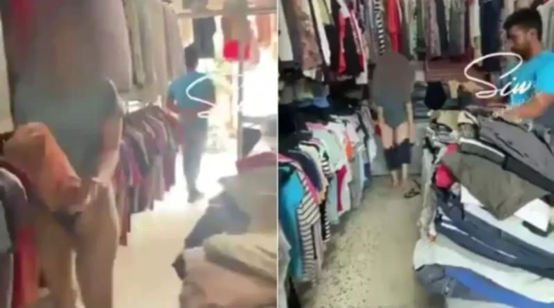 a woman tries all dresses in front of a shopkeeper