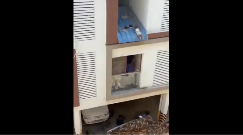 baby stuck on the roof of the chennai apartment balcony